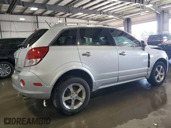 2012 Chevrolet Captiva Sport LTZ z VIN 3GNFL4E51CS652305, wystawiony jako Copart lot #71228894 z przebiegiem 100 002 mil mil oraz Szkoda całkowita • Salvage title. Historia ofert i sprzedaży dostępna na DreamBid. Obrazek 3.