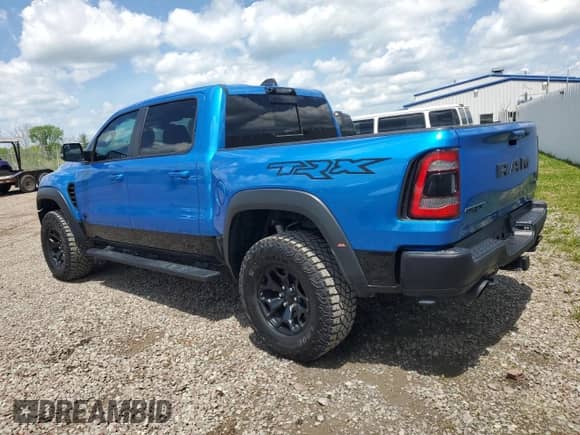 2022 Ram 1500 TRX с VIN 1C6SRFU93NN229879, выставлен на аукционе Copart как лот 58710335 с пробегом 8 047 миль миль и Списание • Salvage title. История ставок и продаж доступна на DreamBid. Изображение 2.