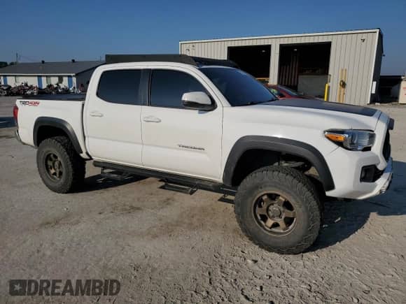 2019 Toyota Tacoma SR with VIN 3TMCZ5AN2KM263276, listed as a Copart auction lot 81008825 with 96,398 mi miles and Salvage title. Bid and sale history available at DreamBid. Image 4.