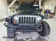2009 Jeep Wrangler X с VIN 1J4FA24169L708281, выставлен на аукционе Copart как лот 85533845 с пробегом 83 553 миль миль и Списание • Salvage title. История ставок и продаж доступна на DreamBid. Изображение 5.