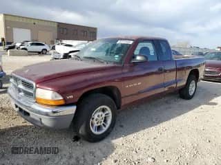 2000 Dodge Dakota Sport with VIN 1B7GL22NXYS695274, listed as a Copart auction lot 52212485 with 105,592 mi miles and Salvage title. Bid and sale history available at DreamBid. Image 1.