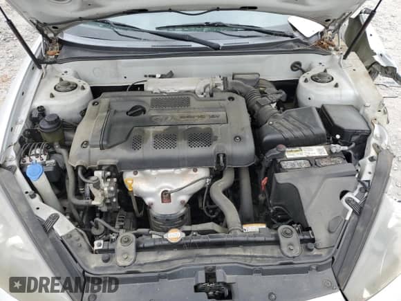 2008 Hyundai Tiburon GS с VIN KMHHM66DX8U288114, выставлен на аукционе Copart как лот 51866995 с пробегом Не указан миль и Списание • Salvage title. История ставок и продаж доступна на DreamBid. Изображение 11.