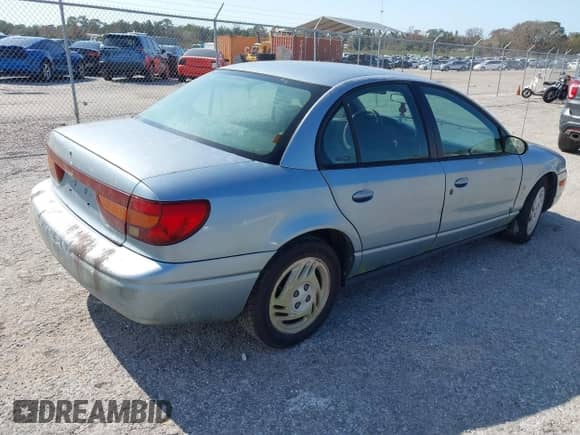 2002 Saturn SL with VIN 1G8ZJ52752Z117416, listed as a IAAI auction lot 41486679 with 318,311 mi miles and . Bid and sale history available at DreamBid. Image 4.