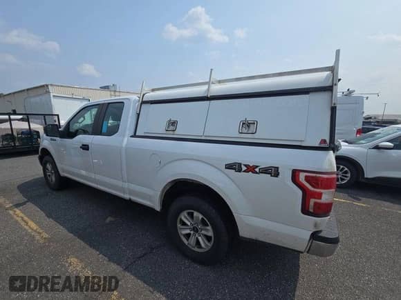 2019 Ford F-150 XL with VIN 1FTEX1EP6KKE99861, listed as a IAAI auction lot 43552263 with 195,197 mi miles and . Bid and sale history available at DreamBid. Image 2.