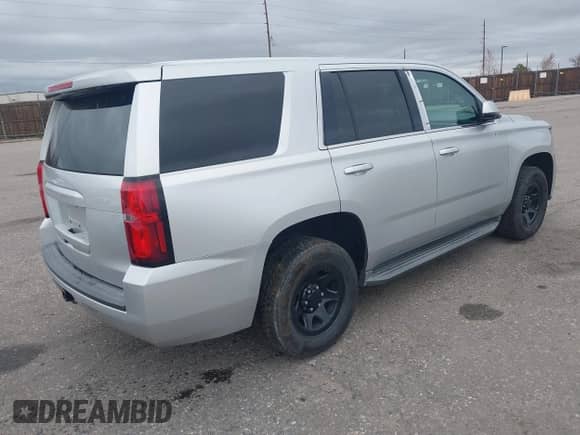2015 Chevrolet Tahoe Commercial z VIN 1GNSK2ECXFR681555, wystawiony jako IAAI lot #41975359 z przebiegiem 126 785 mil mil oraz . Historia ofert i sprzedaży dostępna na DreamBid. Obrazek 4.