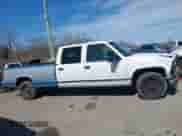 1996 GMC Sierra 1500 z VIN 1GTGC33R4TF018147, wystawiony jako IAAI lot #41612770 z przebiegiem 106 443 mil mil oraz . Historia ofert i sprzedaży dostępna na DreamBid. Obrazek 13.