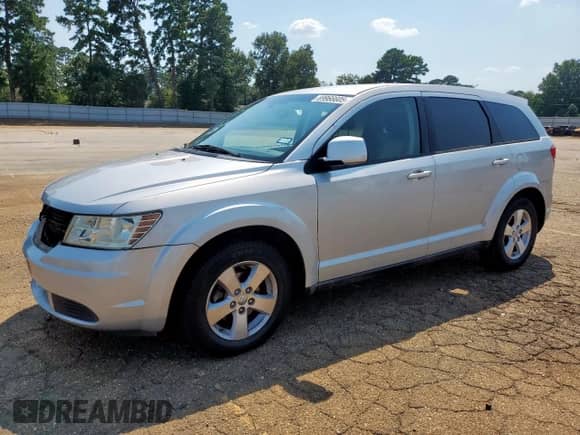 2009 Dodge Journey SXT with VIN 3D4GG57V99T568050, listed as a Copart auction lot 69966605 with 174,837 mi miles and Salvage title. Bid and sale history available at DreamBid. Image 1.