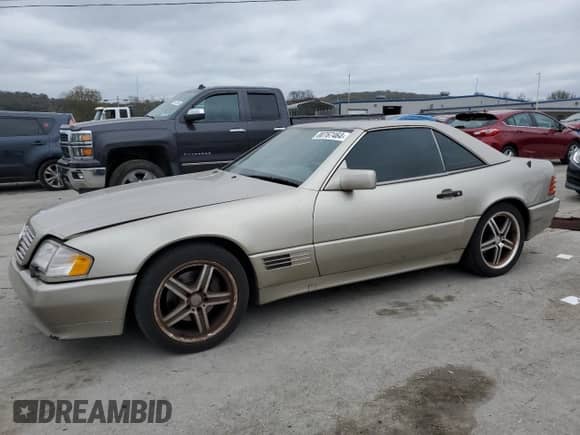 1992 Mercedes-Benz SL с VIN WDBFA66E0NF052678, выставлен на аукционе Copart как лот 80767464 с пробегом 141 748 миль миль и Чистый • Clean title. История ставок и продаж доступна на DreamBid. Изображение 1.