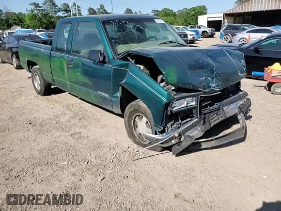 1998 GMC Sierra 1500 z VIN 1GTEC19W4WE521888, wystawiony jako Copart lot #53161505 z przebiegiem 985 004 mil mil oraz Szkoda całkowita • Salvage title. Historia ofert i sprzedaży dostępna na DreamBid. Obrazek 11.