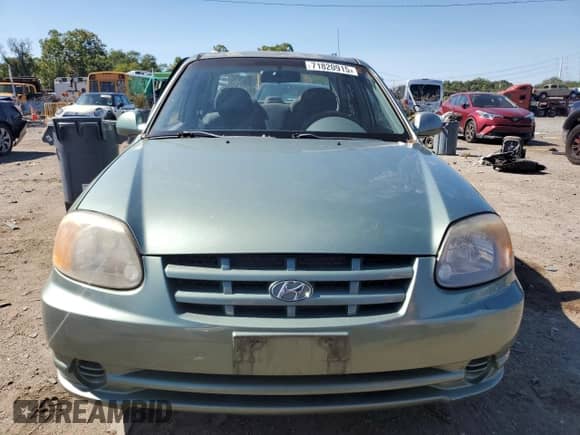 2004 Hyundai Accent GL z VIN KMHCG45C24U503929, wystawiony jako Copart lot #71820915 z przebiegiem 146 643 mil mil oraz Szkoda całkowita • Salvage title. Historia ofert i sprzedaży dostępna na DreamBid. Obrazek 5.