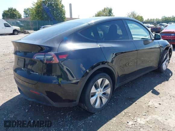 2023 Tesla Model Y Long Range z VIN 7SAYGDEE0PA201841, wystawiony jako IAAI lot #43158634 z przebiegiem 10 356 mil mil oraz . Historia ofert i sprzedaży dostępna na DreamBid. Obrazek 4.