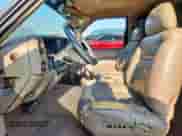 1996 GMC Sierra 1500 z VIN 2GTEC19R4T1552775, wystawiony jako Copart lot #68291925 z przebiegiem 146 095 mil mil oraz Szkoda całkowita • Salvage title. Historia ofert i sprzedaży dostępna na DreamBid. Obrazek 7.
