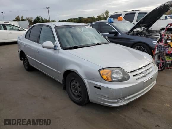 2005 Hyundai Accent GLS z VIN KMHCG45C45U631414, wystawiony jako Copart lot #73963814 z przebiegiem 106 617 mil mil oraz Szkoda całkowita • Salvage title. Historia ofert i sprzedaży dostępna na DreamBid. Obrazek 4.