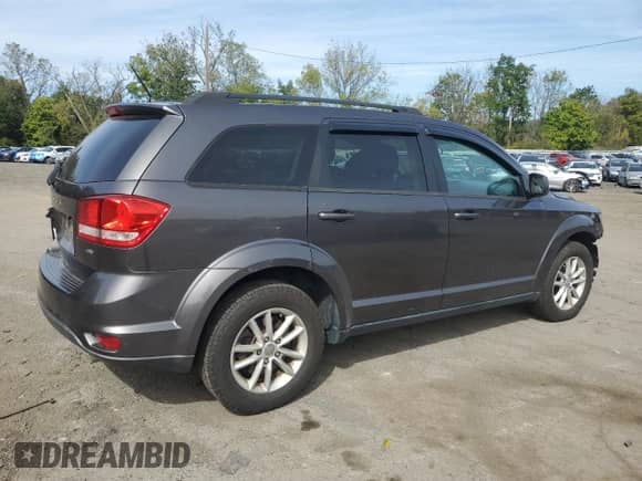 2014 Dodge Journey SXT with VIN 3C4PDDBG8ET242064, listed as a Copart auction lot 83820625 with 89,956 mi miles and Salvage title. Bid and sale history available at DreamBid. Image 3.