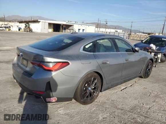 2024 BMW i4 eDrive35 with VIN WBY43AW06RFS38949, listed as a Copart auction lot 46886215 with 11,924 mi miles and Salvage title. Bid and sale history available at DreamBid. Image 3.