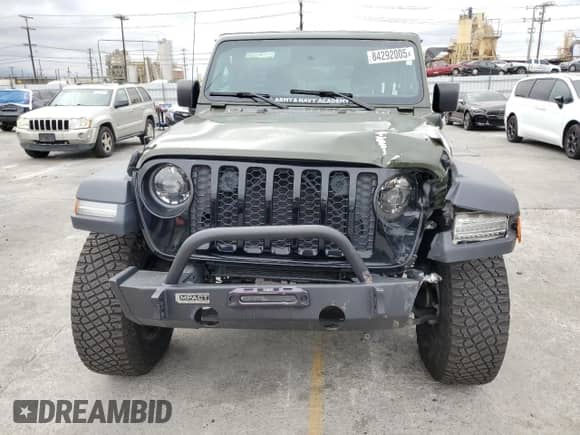 2023 Jeep Wrangler with VIN 1C4JJXN6XPW592022, listed as a Copart auction lot 84292005 with 33,727 mi miles and Salvage title. Bid and sale history available at DreamBid. Image 5.
