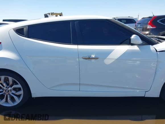 2014 Hyundai Veloster z VIN KMHTC6AD4EU213537, wystawiony jako IAAI lot #43358808 z przebiegiem 54 973 mil mil oraz . Historia ofert i sprzedaży dostępna na DreamBid. Obrazek 13.