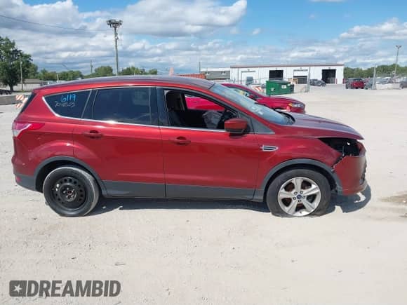 2014 Ford Escape SE with VIN 1FMCU0GX5EUC16474, listed as a IAAI auction lot 40276119 with 112,714 mi miles and . Bid and sale history available at DreamBid. Image 12.