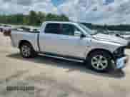 2014 Ram 1500 Laramie with VIN 1C6RR6NT0ES397960, listed as a Copart auction lot 61458895 with 148,298 mi miles and Salvage title. Bid and sale history available at DreamBid. Image 4.