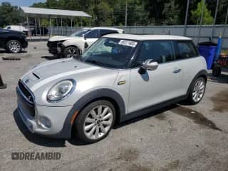 2018 MINI Hardtop Cooper S с VIN WMWXP7C59J2A48077, выставлен на аукционе Copart как лот 66371405 с пробегом 126 033 миль миль и Списание • Salvage title. История ставок и продаж доступна на DreamBid. Изображение 1.