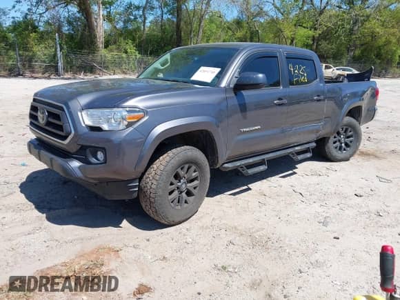 2021 Toyota Tacoma SR5 z VIN 5TFDZ5BN6MX059581, wystawiony jako IAAI lot #42051740 z przebiegiem 65 399 mil mil oraz . Historia ofert i sprzedaży dostępna na DreamBid. Obrazek 18.