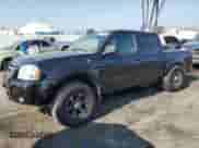 2004 Nissan Frontier XE with VIN 1N6ED27T64C477426, listed as a Copart auction lot 68329535 with 132,259 mi miles and Salvage title. Bid and sale history available at DreamBid. Image 1.