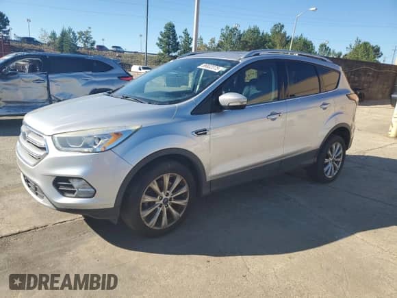 2017 Ford Escape Titanium with VIN 1FMCU9J98HUE25145, listed as a Copart auction lot 86802075 with 156,471 mi miles and Clean title. Bid and sale history available at DreamBid. Image 1.