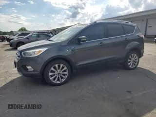 2017 Ford Escape Titanium с VIN 1FMCU0JD6HUD17364, выставлен на аукционе Copart как лот 68642355 с пробегом 87 671 миль миль и Списание • Salvage title. История ставок и продаж доступна на DreamBid. Изображение 1.