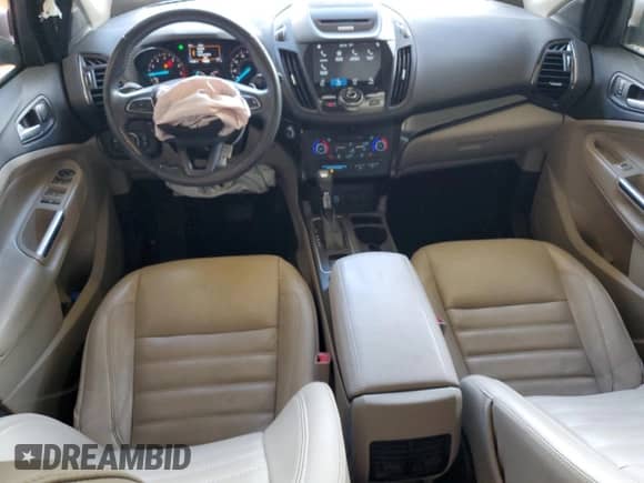 2017 Ford Escape Titanium с VIN 1FMCU0JD8HUE35755, выставлен на аукционе Copart как лот 68698985 с пробегом 111 087 миль миль и Списание • Salvage title. История ставок и продаж доступна на DreamBid. Изображение 8.