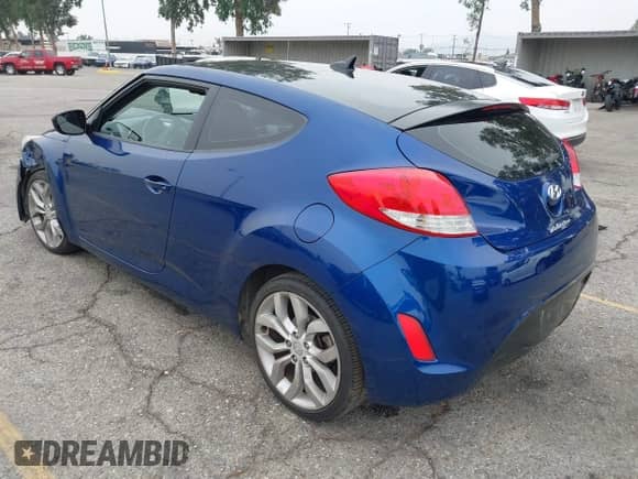 2015 Hyundai Veloster z VIN KMHTC6AD0FU243328, wystawiony jako IAAI lot #42439313 z przebiegiem 96 997 mil mil oraz . Historia ofert i sprzedaży dostępna na DreamBid. Obrazek 3.