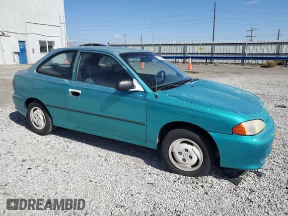 1995 Hyundai Accent z VIN KMHVD14N1SU015961, wystawiony jako Copart lot #72066404 z przebiegiem 118 163 mil mil oraz Szkoda całkowita • Salvage title. Historia ofert i sprzedaży dostępna na DreamBid. Obrazek 4.