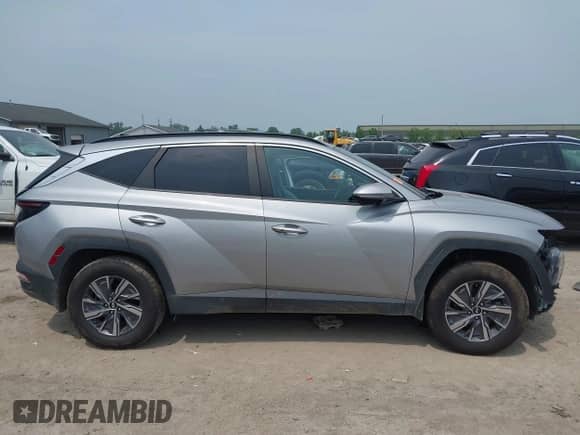 2022 Hyundai Tucson Blue with VIN KM8JBCA1XNU077977, listed as a IAAI auction lot 42868058 with 76,081 mi miles and . Bid and sale history available at DreamBid. Image 14.