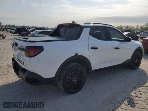 2022 Hyundai Santa Cruz SEL z VIN 5NTJCDAEXNH028008, wystawiony jako Copart lot #76730034 z przebiegiem 54 648 mil mil oraz Szkoda całkowita • Salvage title. Historia ofert i sprzedaży dostępna na DreamBid. Obrazek 3.