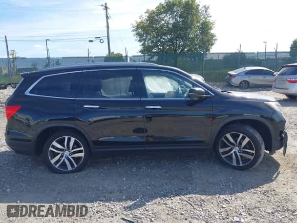 2018 Honda Pilot Touring z VIN 5FNYF6H95JB052993, wystawiony jako IAAI lot #43356643 z przebiegiem Nie podano mil oraz . Historia ofert i sprzedaży dostępna na DreamBid. Obrazek 12.
