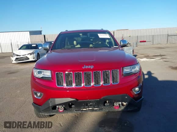2015 Jeep Grand Cherokee Overland z VIN 1C4RJFCG6FC613232, wystawiony jako IAAI lot #43476794 z przebiegiem 106 697 mil mil oraz . Historia ofert i sprzedaży dostępna na DreamBid. Obrazek 13.