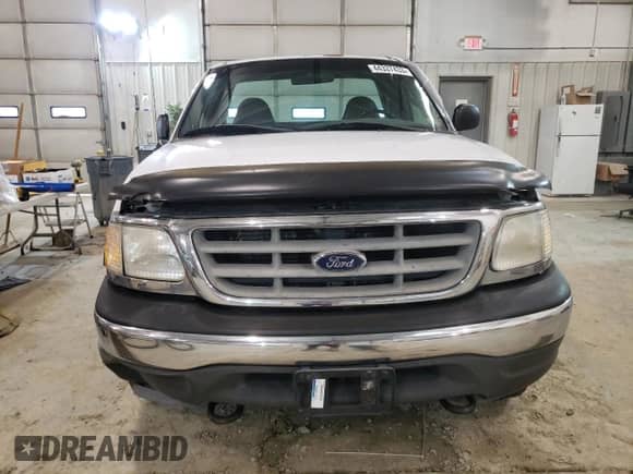 2002 Ford F-150 XL z VIN 1FTRF18W72KB04366, wystawiony jako Copart lot #54933503 z przebiegiem 182 593 mil mil oraz Nie do naprawy • Non repairable. Historia ofert i sprzedaży dostępna na DreamBid. Obrazek 5.