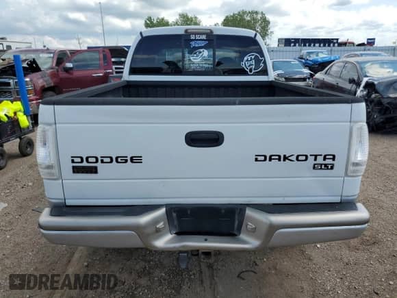 2003 Dodge Dakota SLT с VIN 1D7HG48N13S177855, выставлен на аукционе Copart как лот 62500025 с пробегом 76 678 миль миль и Списание • Salvage title. История ставок и продаж доступна на DreamBid. Изображение 6.