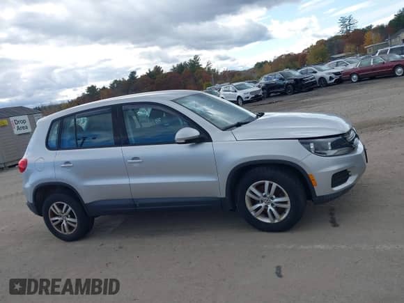 2014 Volkswagen Tiguan S with VIN WVGBV3AXXEW596502, listed as a IAAI auction lot 43538779 with 111,908 mi miles and . Bid and sale history available at DreamBid. Image 13.