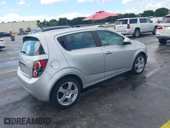 2015 Chevrolet Sonic LTZ with VIN 1G1JE6SB2F4103387, listed as a IAAI auction lot 43400010 with 74,902 mi miles and . Bid and sale history available at DreamBid. Image 4.