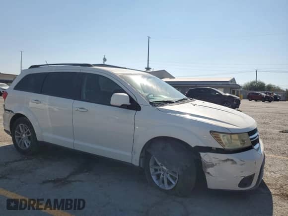 2014 Dodge Journey SXT with VIN 3C4PDCBB7ET119077, listed as a Copart auction lot 68337365 with 99,909 mi miles and Salvage title. Bid and sale history available at DreamBid. Image 4.