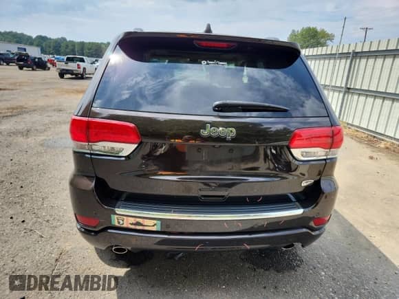 2017 Jeep Grand Cherokee Overland with VIN 1C4RJECG1HC659385, listed as a Copart auction lot 82172205 with 67,873 mi miles and Salvage title. Bid and sale history available at DreamBid. Image 6.