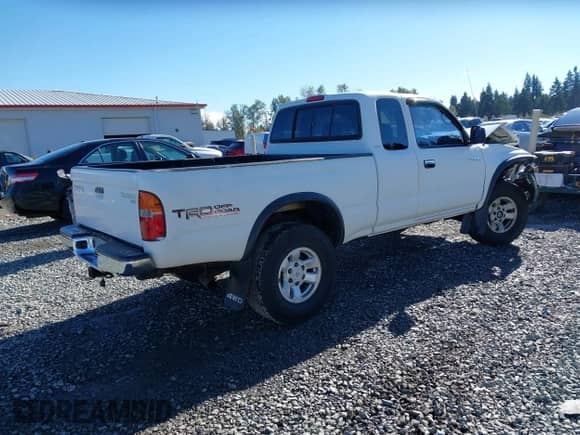 2000 Toyota Tacoma with VIN 5TEWM72N9YZ709411, listed as a IAAI auction lot 43417590 with 249,085 mi miles and . Bid and sale history available at DreamBid. Image 4.