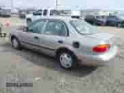 1999 Chevrolet Prizm z VIN 1Y1SK5488XZ446950, wystawiony jako IAAI lot #41798129 z przebiegiem 292 798 mil mil oraz . Historia ofert i sprzedaży dostępna na DreamBid. Obrazek 3.