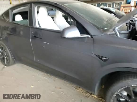 2021 Tesla Model Y Long Range with VIN 5YJYGDEE7MF206059, listed as a Copart auction lot 80559965 with 77,329 mi miles and Salvage title. Bid and sale history available at DreamBid. Image 13.