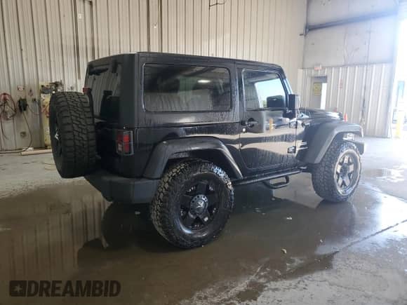 2012 Jeep Wrangler Sport with VIN 1C4AJWAG4CL215593, listed as a Copart auction lot 71013325 with 112,333 mi miles and Salvage title. Bid and sale history available at DreamBid. Image 3.