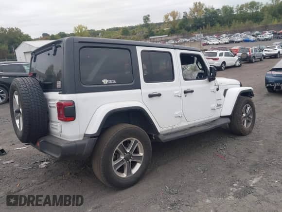 2023 Jeep Wrangler Sahara Altitude with VIN 1C4HJXEG9PW502267, listed as a IAAI auction lot 43266621 with 85,629 mi miles and . Bid and sale history available at DreamBid. Image 4.