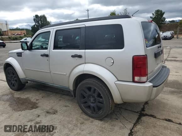 2011 Dodge Nitro Heat with VIN 1D4PT4GK8BW597552, listed as a Copart auction lot 82399605 with 262,822 mi miles and Salvage title. Bid and sale history available at DreamBid. Image 2.