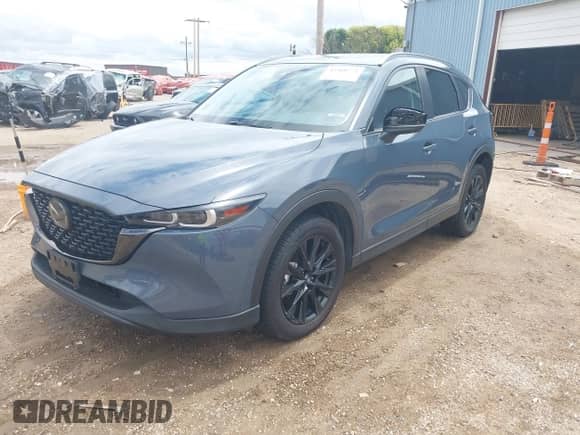 2022 Mazda CX-5 S Preferred z VIN JM3KFBCM8N1581273, wystawiony jako IAAI lot #42568772 z przebiegiem 23 557 mil mil oraz . Historia ofert i sprzedaży dostępna na DreamBid. Obrazek 2.