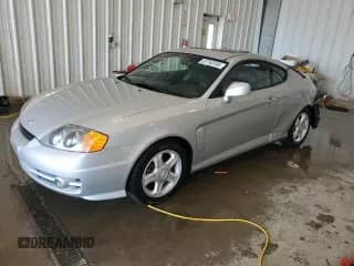2003 Hyundai Tiburon GT с VIN KMHHN65F53U019155, выставлен на аукционе Copart как лот 67763185 с пробегом 66 114 миль миль и На запчасти • Non repairable. История ставок и продаж доступна на DreamBid. Изображение 1.