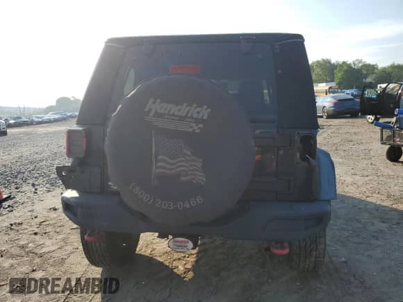 2013 Jeep Wrangler Rubicon 10th Anniversary with VIN 1C4BJWCG7DL651647, listed as a Copart auction lot 66891325 with 178,266 mi miles and Salvage title. Bid and sale history available at DreamBid. Image 6.